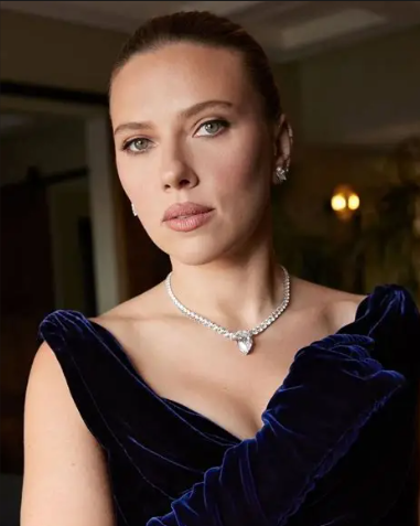 Scarlett Johansson posing at a Hollywood red carpet event.