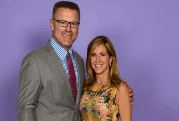 Diane Addonizio posing with husband Howie Long during a public event alongside their successful football family.